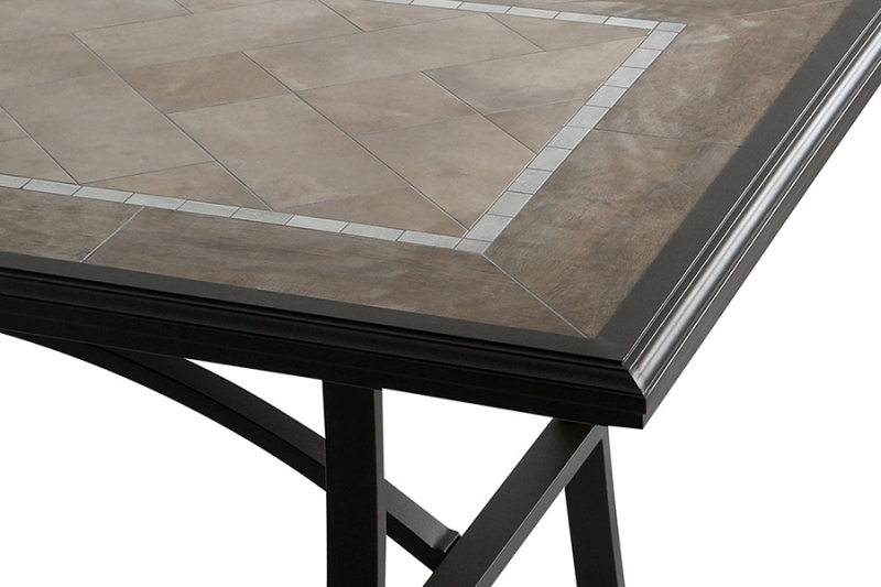 An elegant and sophisticated dining table with a tile top and (intricate) metal leg detail. A stylish choice for your patio spaces.