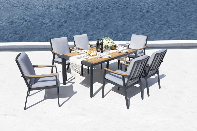 Curves handrail diffuses a graceful episode. This teak tabletop brings a sense of nature and freshness. Crafted with teak and aluminum design, black painted finishes with gray cushions, the Nova collection redefines modern elegance.